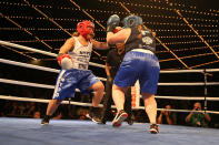 <p>Stacy Weinstein, left, goes on the attack against Katie Walsh during the NYPD Boxing Championships at the Theater at Madison Square Garden on June 8, 2017. (Gordon Donovan/Yahoo News) </p>