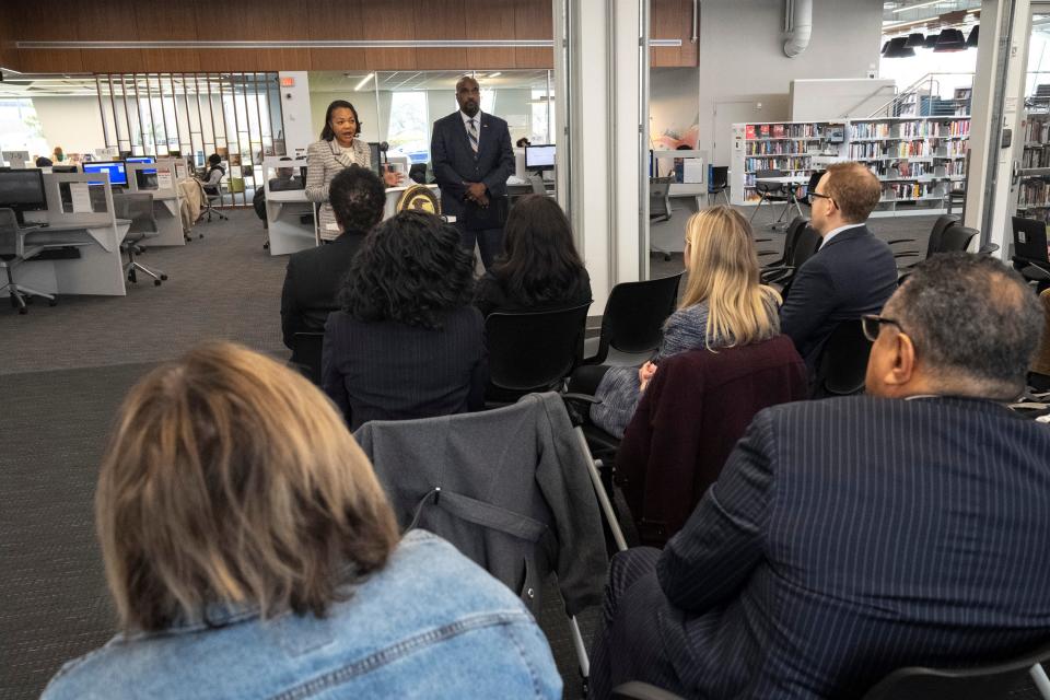 Feb 28, 2023; Columbus, Ohio, United States;  U.S. Assistant Attorney General Kristen Clarke, top left, stands next to U.S. Attorney Kenneth L. Parker while speaking during a press conference at the Columbus Metropolitan Library Martin Luther King branch regarding a civil settlement involving Park National Bank. Mandatory Credit: Joseph Scheller-The Columbus Dispatch