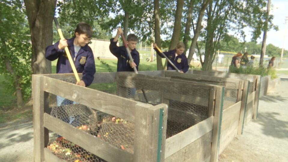 Students compost organic waste from the cafeteria.