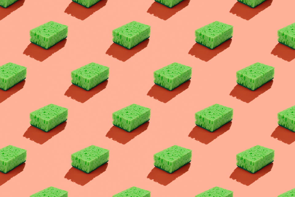 Green sponges on a pink background to symbolize green washing.