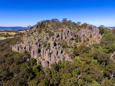 This jagged outcrop rises from an open plain around 50 miles north-west of Melbourne - Credit: GETTY