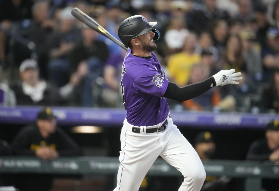 Colorado Rockies right fielder Kris Bryant follows the flight of his solo home run off Rich Hill in the third inning Monday. (AP Photo/David Zalubowski)