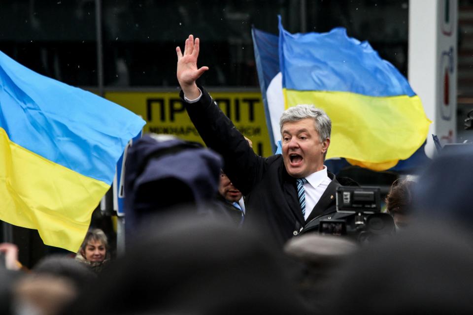 Ukraine's former leader Petro Poroshenko addresses supporters after his arrival at an airport outside Kyiv, January 17, 2022. / Credit: ALEKSEY FILIPPOV/AFP/Getty