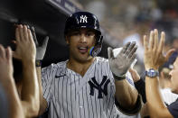 New York Yankees designated hitter Giancarlo Stanton is congratulated after hitting a two-run home run against the Detroit Tigers during the sixth inning of a baseball game Tuesday, Sept. 5, 2023, in New York. The home run was Stanton's 400th in the majors. (AP Photo/Adam Hunger)