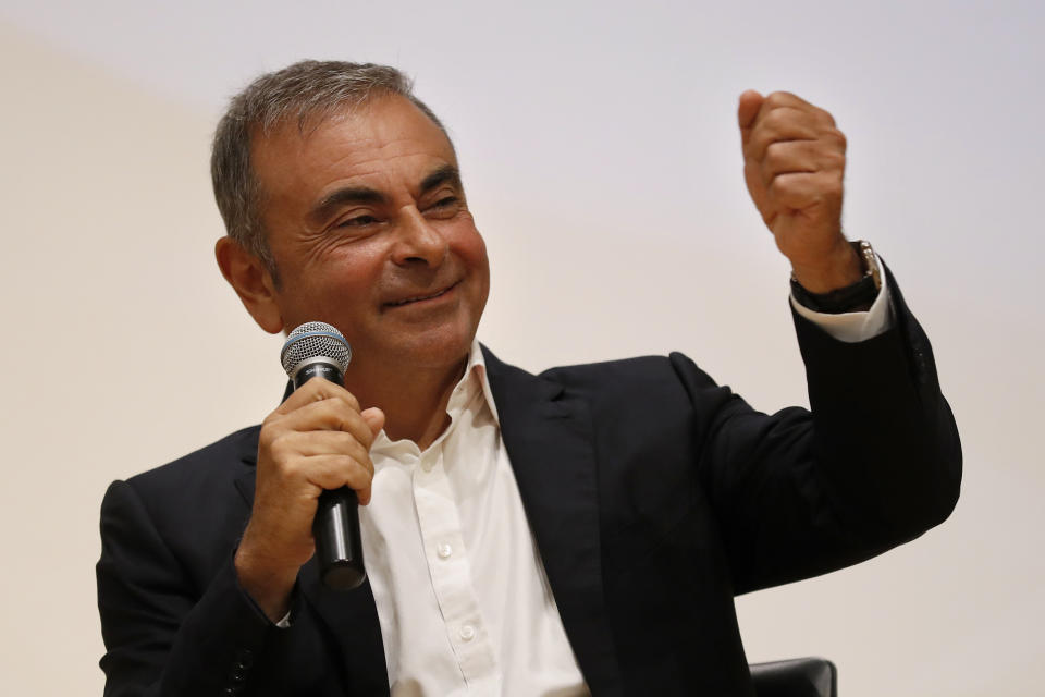 Former Nissan Motor Co. Chairman Carlos Ghosn holds a press conference at the Maronite Christian Holy Spirit University of Kaslik, as he launches an initiative to help Lebanon that is undergoing a severe economic and financial crisis, in Kaslik, north of Beirut, Lebanon, Tuesday, Sept. 29, 2020. Ghosn was arrested in Japan in 2018, and was awaiting trial on charges of under-reporting future income and breach of trust when he jumped bail and escaped to Lebanon late last year. (AP Photo/Hussein Malla)