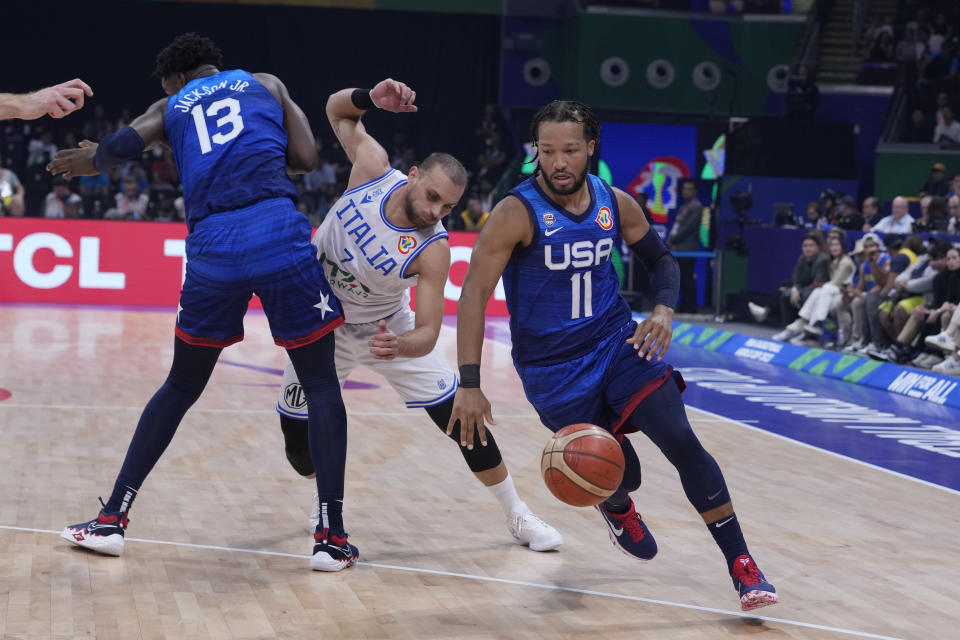 U.S. guard Jalen Brunson (11) drives during the Basketball World Cup quarterfinal game between Italy and U.S. at the Mall of Asia Arena in Manila, Philippines, Tuesday Sept. 5, 2023. (AP Photo/Michael Conroy)