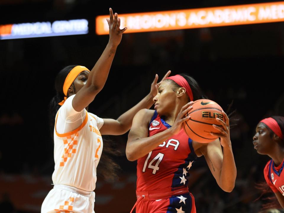 U.S. national team's Betnijah Laney (14) tries to protect the ball from Tennessee's Rickea Jackson (2) during an exhibition basketball game on Sunday, November 5, 2023 In Knoxville, Tenn.