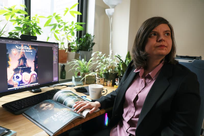 Author Kashtanova sits in their office in New York City