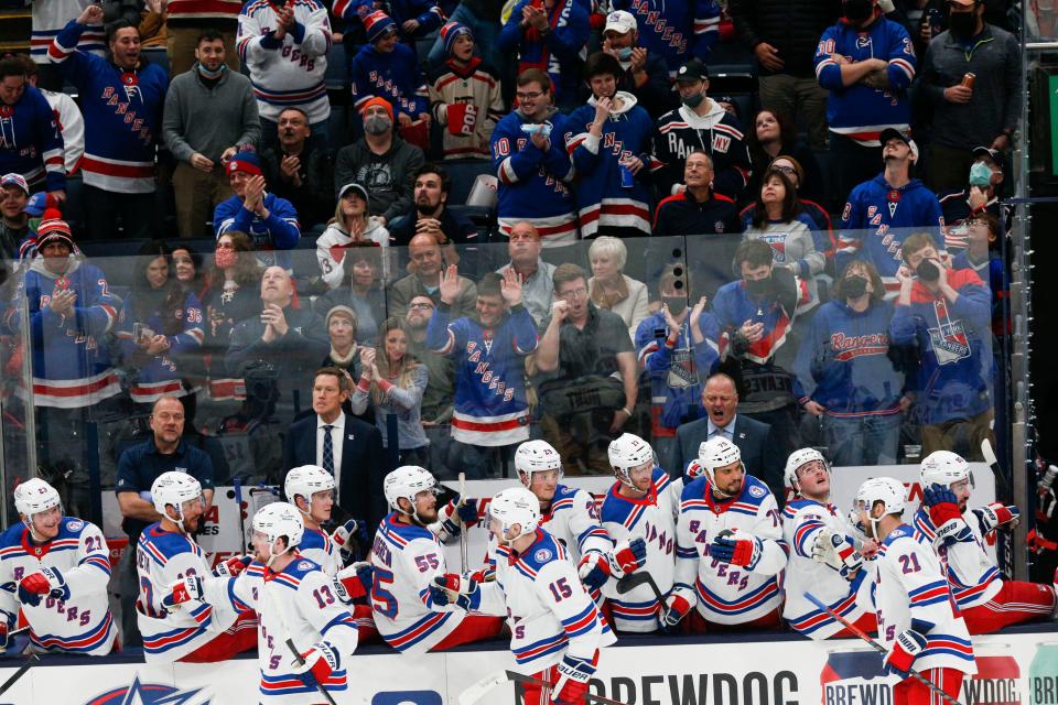 The New York Rangers fans and team celebrate a fourth goal during the NHL game at Nationwide Arena in Columbus, Ohio, on Saturday, Nov. 13, 2021.