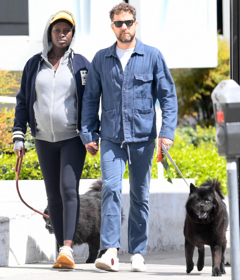 <p>Joshua Jackson and Jodie Turner-Smith — due with their first child together on Thursday — keep things moving with their dogs in L.A. on Wednesday.</p>