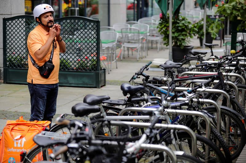 Former Afghan Communication Minister Sadaat works as a bicycle rider for the food delivery service Lieferando in Leipzig