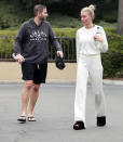 <p>Newlyweds Tarik and Heather Rae El Moussa are spotted after working up a sweat at a gym in Newport Beach, Calif. on Dec. 23. </p>