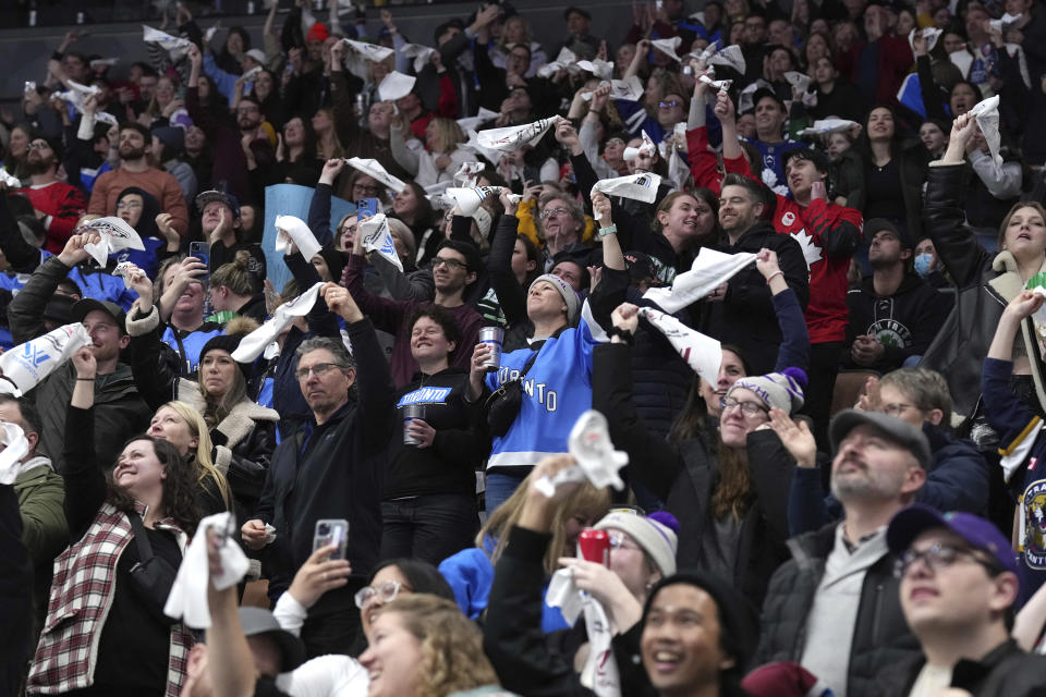 Fans celebrate after a Toronto goal against Montreal during third-period PWHL hockey game action in Toronto, Friday, Feb. 16, 2024. (Chris Young/The Canadian Press via AP)