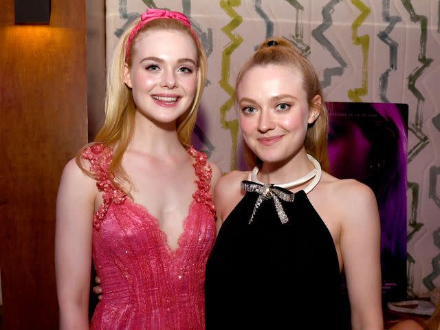 <p>Kevin Winter/Getty</p> Elle Fanning and Dakota Fanning on April 2, 2019