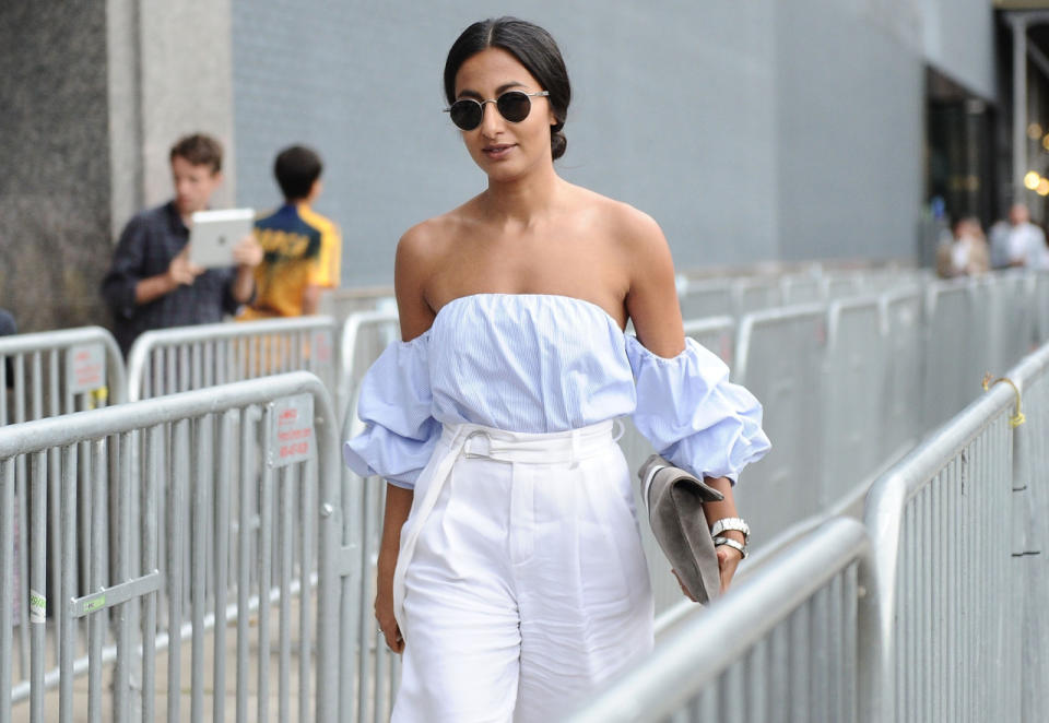 A street style star showing off her shoulders at New York Fashion Week.