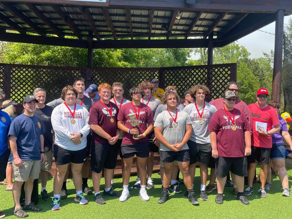 Niceville High School football players were the winners of the firetruck pull to raise funds for the Twin Cities Pavilion facility's renovation.