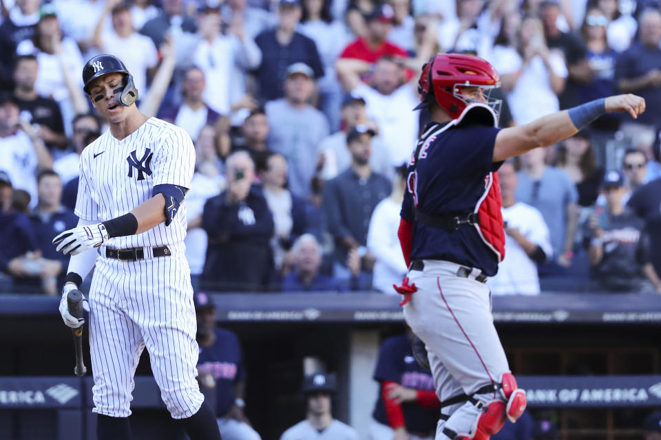 New York Yankees' Aaron Judge reacts after striking out against as Boston Red Sox catcher Reese McGuire throws the ball during the seventh inning of a baseball game Saturday, Sept. 24, 2022, in New York. (AP Photo/Jessie Alcheh)