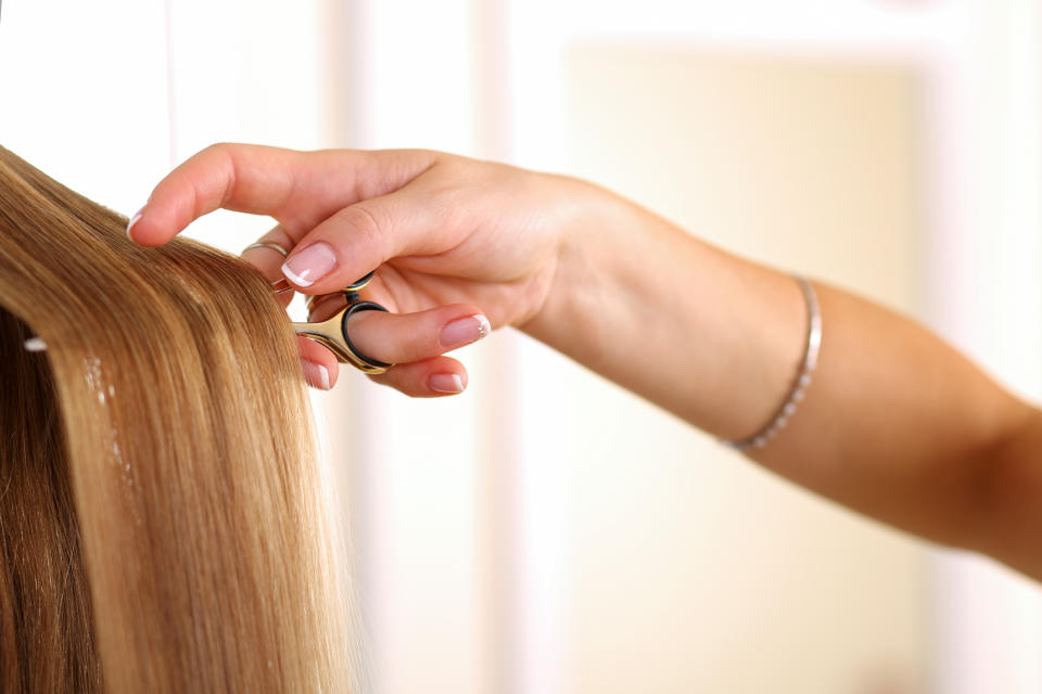 A new TikTok trend has seen people clarifying their hair with scissors. (Posed by model, Getty Images)