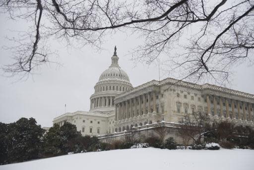 El Capitolio de EEUU, en Washington, cubierto de nieve el 13 de febrero de 2014, después de una tormenta (AFP | Saul Loeb)