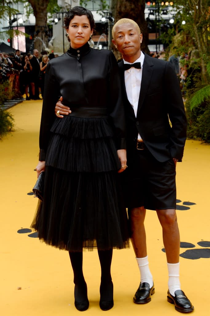 Pharrell Williams poses with wife Helen Lasichanh at the London premiere of “The Lion King.” - Credit: Shutterstock