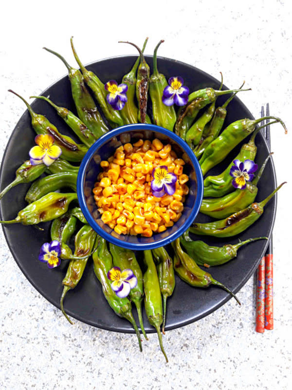 <p>Profusion Curry</p><p>Grilled shishito peppers and corn is a healthy and delicious appetizer ideal for summer picnics or as a bbq side dish.</p><p><strong>Get the Recipe</strong><strong>: <a href="https://profusioncurry.com/grilled-corn-and-shishito-peppers-recipe/" rel="nofollow noopener" target="_blank" data-ylk="slk:Grilled Corn and Shishito Peppers;elm:context_link;itc:0;sec:content-canvas" class="link ">Grilled Corn and Shishito Peppers</a></strong></p>