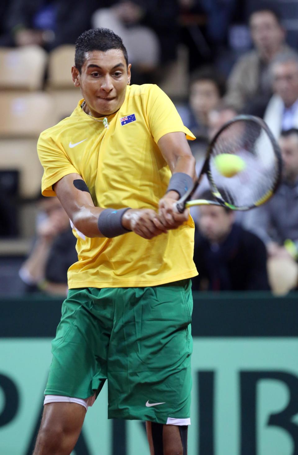 Australia's Nick Kyrgios returns the ball to France's Richard Gasquet during their single match, in the first round of the Davis Cup between France and Australia, in La Roche sur Yon, western France, Friday Jan. 31, 2014.(AP Photo/Remy de la Mauviniere)