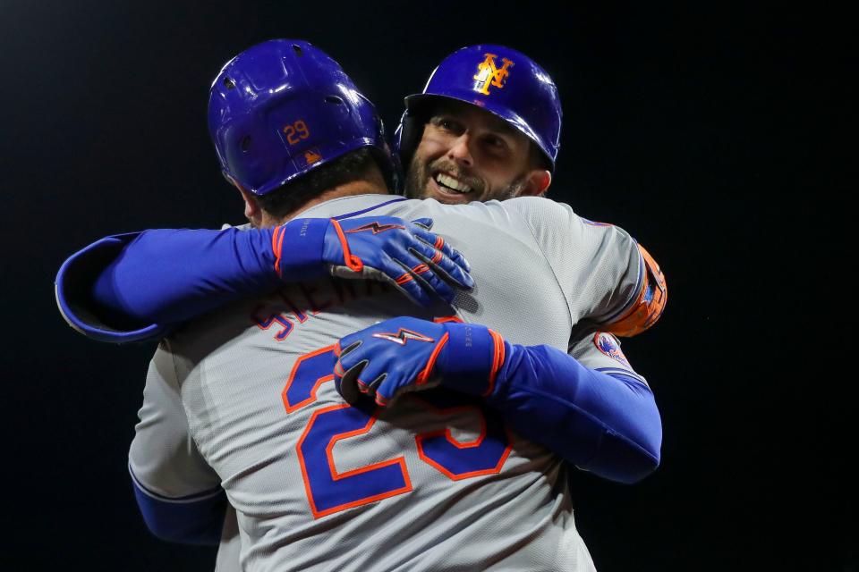 New York Mets second baseman Jeff McNeil (1) hugs designated hitter DJ Stewart (29) after hitting a solo home run in the eighth inning against the Cincinnati Reds on April 5, 2024, at Great American Ball Park in Cincinnati, Ohio.