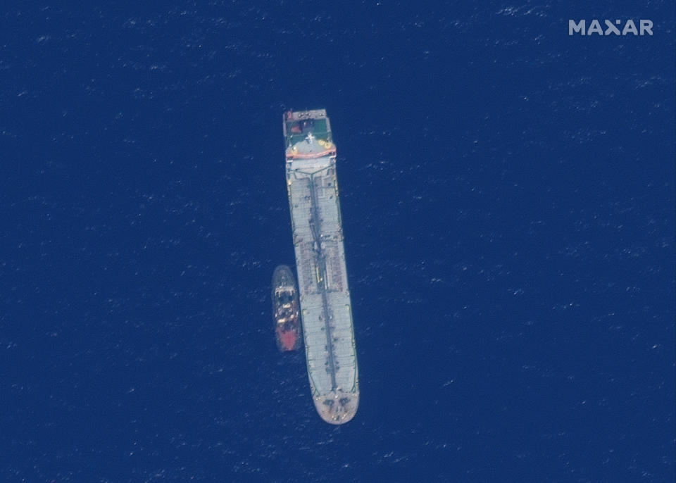 This satellite image provided by Maxar Technologies shows the oil tanker Kokuka Courageous off the coast of Fujairah, United Arab Emirates, Monday, June 17, 2019. New satellite photos released Monday show two oil tankers apparently attacked in the Gulf of Oman last week. The U.S. alleges Iran used limpet mines to strike the two tankers. Iran has denied being involved. (Satellite image ©2019 Maxar Technologies via AP)