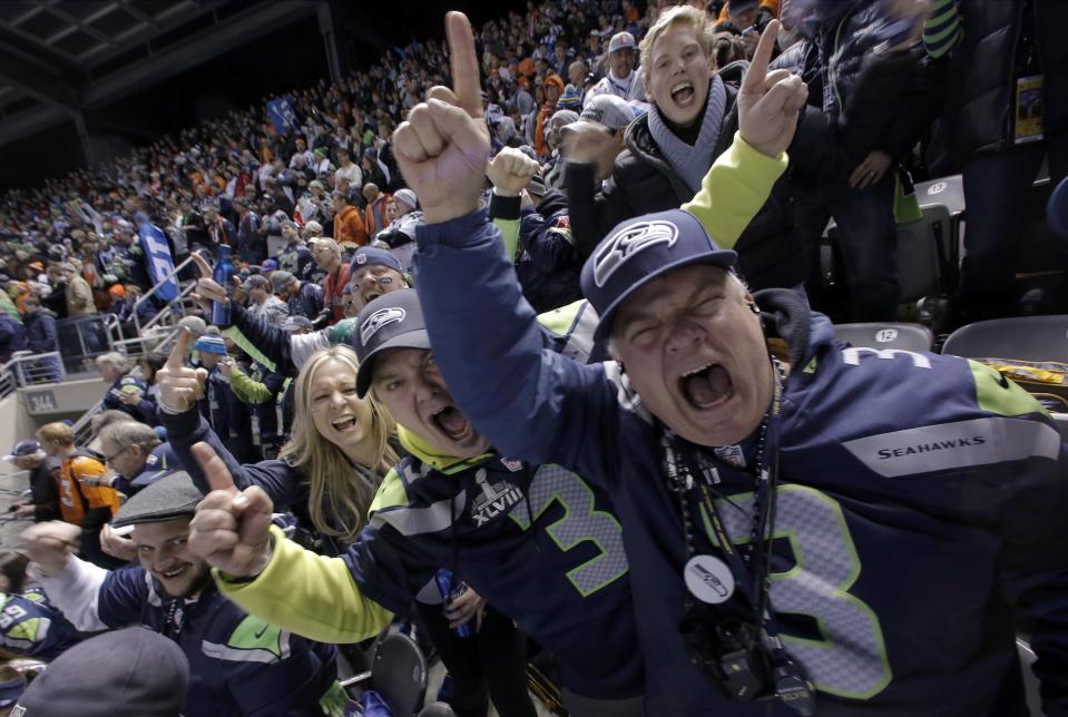 Seattle Seahawks fans cheer for their team in the first quarter of the NFL Super Bowl XLVIII football game against the Denver Broncos in East Rutherford