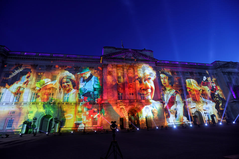 LONDON, ENGLAND - JUNE 02: Projections displayed on the front of Buckingham Palace depicting Queen Elizabeth II during The Lighting Of The Principal Beacon at Buckingham Palace on June 02, 2022 in London, England. The Platinum Jubilee of Elizabeth II is being celebrated from June 2 to June 5, 2022, in the UK and Commonwealth to mark the 70th anniversary of the accession of Queen Elizabeth II on 6 February 1952.  (Photo by Chris Jackson -WPA Pool/Getty Images)