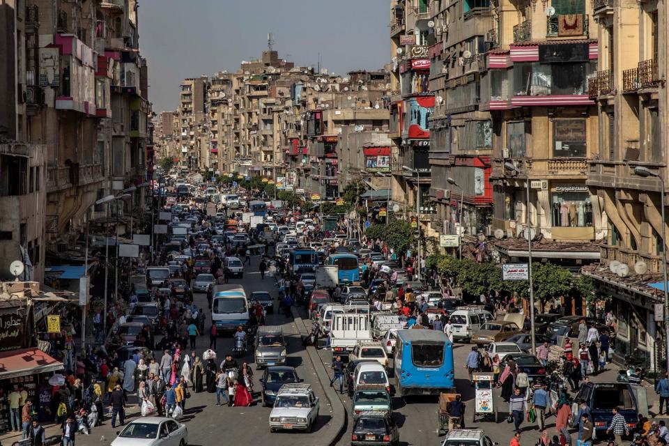 Busy streets in Cairo ahead of the coronavirus curfew (AP)