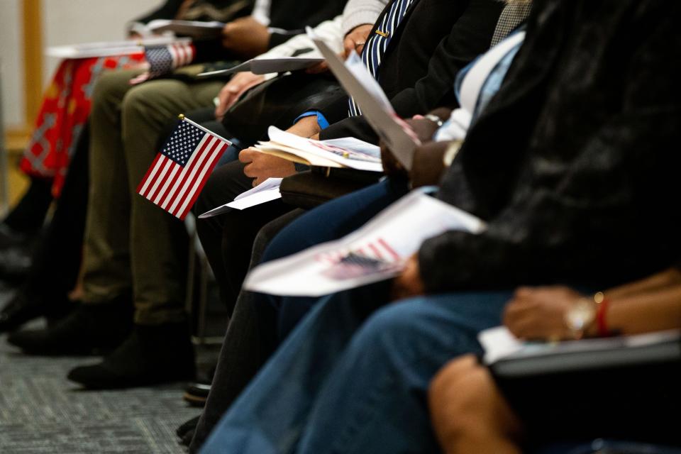 Dozens of people from across the globe were granted U.S. citizenship during a naturalization ceremony Thursday, Oct. 20, 2022, at Herrick District Library in Holland.