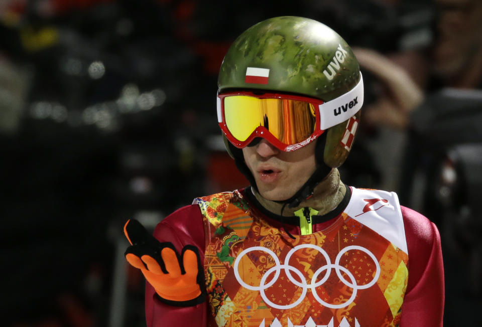 Poland's Kamil Stoch blows a kiss after his first attempt during the men's normal hill ski jumping final at the 2014 Winter Olympics, Sunday, Feb. 9, 2014, in Krasnaya Polyana, Russia. (AP Photo/Gregorio Borgia)