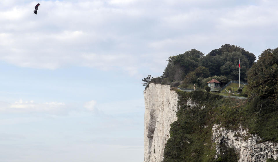 French inventor Franky Zapata lands near St. Margaret's beach, Dover after crossing the Channel on a flying board Sunday, Aug. 4, 2019. (Steve Parsons/PA via AP)