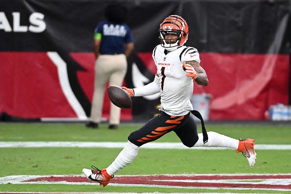 Ja'Marr Chase celebrates catching a touchdown pass against the Arizona Cardinals during the third quarter.