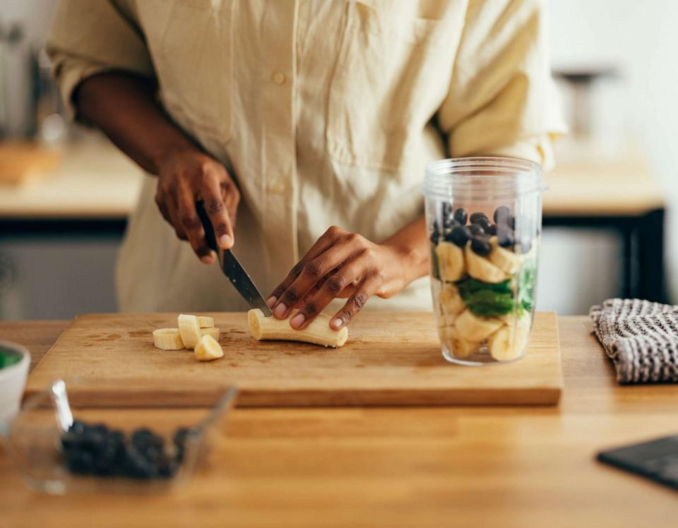 PHOTO: A woman makes a healthy breakfast on a kitchen table. (STOCK PHOTO/Getty Images)