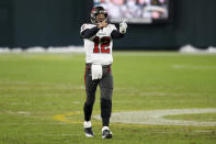 Tampa Bay Buccaneers quarterback Tom Brady reacts after winning the NFC championship NFL football game against the Green Bay Packers in Green Bay, Wis., Sunday, Jan. 24, 2021. The Buccaneers defeated the Packers 31-26 to advance to the Super Bowl. (AP Photo/Matt Ludtke)