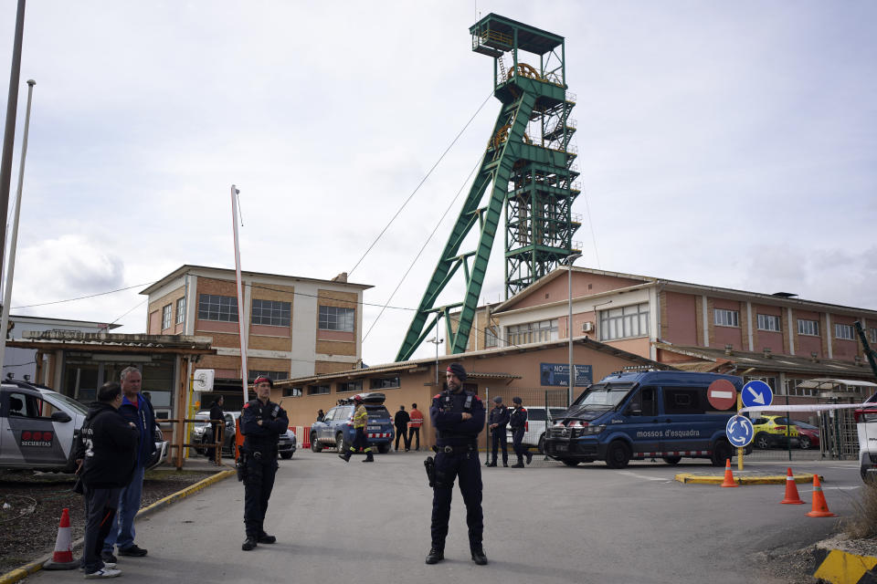 Catalan police cordon off the area at the entrance of the Cabanasses de Súria mine around 80 kilometers (50 miles) northwest of Barcelona, Spain, Thursday, March 9, 2023. Three workers died after becoming trapped deep underground in a potash mine in northeastern Spain on Thursday, firefighters said. (AP Photo/Joan Mateu Parra)