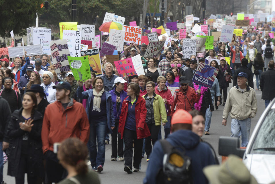 Crowds march up Church Street towards Romare Bearden Park during Saturday's Women's March on Charlotte, which drew at least 10,000 people according to CMPD. The mile-long march was scheduled to coincide with a national demonstration Saturday, Jan. 21, 2017, in Washington, D.C., the day after Donald Trump's inauguration as president. The march started at First Ward Park, traveled down Tryon Street to 4th St. to Church St. and ended at Romare Bearden Park. "The Women's March on Charlotte is a first step in uniting our communities and in empowering grassroots change," march organizers say on the march's website. "We will work peacefully to send a bold message to our elected leaders that women's rights are human rights." (Diedra Laird/The Charlotte Observer via AP)