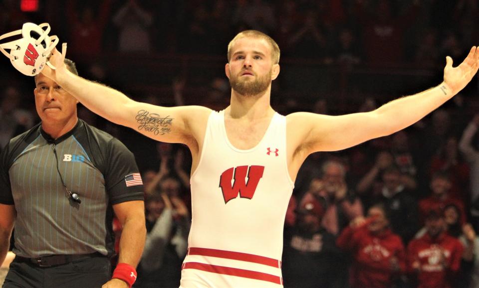 Wisconsin's Tyler Dow celebrates after pinning Iowa's Abe Assad during the teams' dual at the UW Field House in Madison, Wis. on Sunday, Jan. 22, 2023.