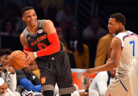 Feb 19, 2017; New Orleans, LA, USA; Western Conference guard Russell Westbrook of the Oklahoma City Thunder (0) handles the ball against Eastern Conference guard Kyle Lowry of the Toronto Raptors (7) in the 2017 NBA All-Star Game at Smoothie King Center. Mandatory Credit: Bob Donnan-USA TODAY Sports