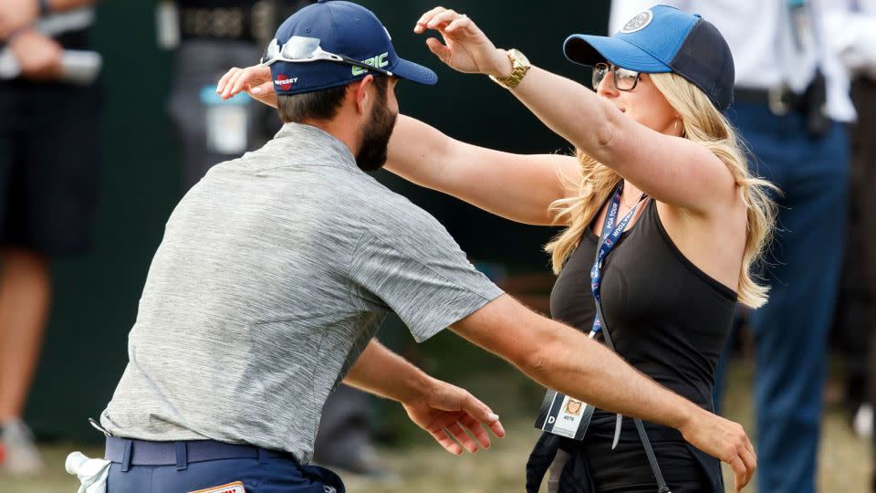 Hadwin hugs his then-fiance Jessica after clinching his first PGA Tour title at the 2017 Valspar Championship. - Mike Carlson/AP