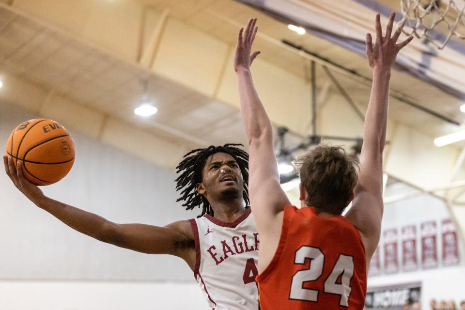 Oklahoma Christian's Ca'Ron Banks goes up for a layup as Dale's Trayden Chambers (24) tries to block during a boys high school basketball game between Oklahoma Christian Academy and Dale High School at Oklahoma Christian Academy in Edmond, Okla., on Friday, Jan. 27, 2023.