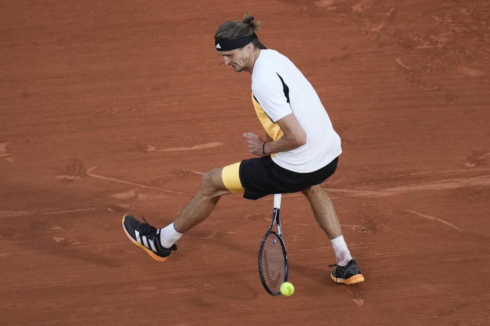 Germany's Alexander Zverev plays a shot between his legs during the semifinal match of the French Open tennis tournament against Norway's Casper Ruud at the Roland Garros stadium in Paris, Friday, June 7, 2024. (AP Photo/Christophe Ena)