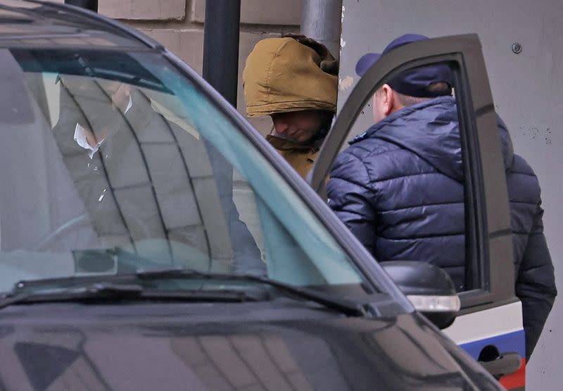 Reporter for U.S. newspaper The Wall Street Journal Evan Gershkovich leaves a court building in Moscow