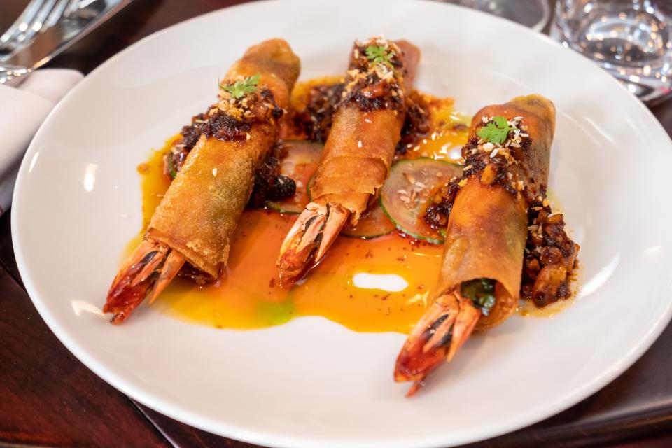 Crispy shrimp spring rolls made with prawns, thai peanut sauce, fermented black bean, cucumber and coconut at the Red Horse.