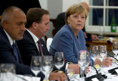 Germany's Chancellor Angela Merkel sits next to Sweden's Prime Minister Stefan Lofven and Bulgarian counterpart Boyko Borisov during a dinner ahead of an informal European Union leaders summit in Tallinn, Estonia September 28, 2017. REUTERS/Virginia Mayo/Pool