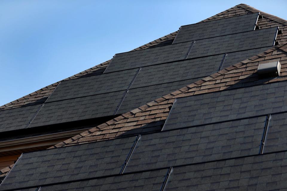 Solar panels are seen on the home of Joey Miles Wednesday, March 3, 2021 in the Franklin Trace neighborhood in Indianapolis. He faced obstacles from his HOA to get solar power on his home. Now he has them, but they are not optimally oriented because they have to be on the side of the house away from street view.