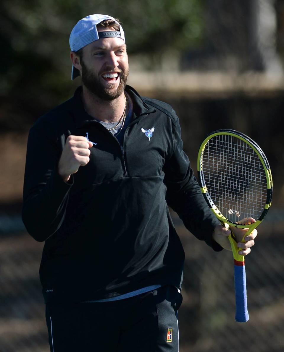 Professional tennis player Jack Sock pumps his fist after winning a point against his coach Alex Bogomolov Jr. at the Cabarrus Country Club in Concord, NC on Wednesday, January 20, 2021.