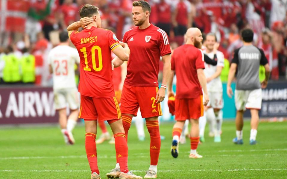 Chris Gunter commiserates with Aaron Ramsey after Wales' exit - AFP